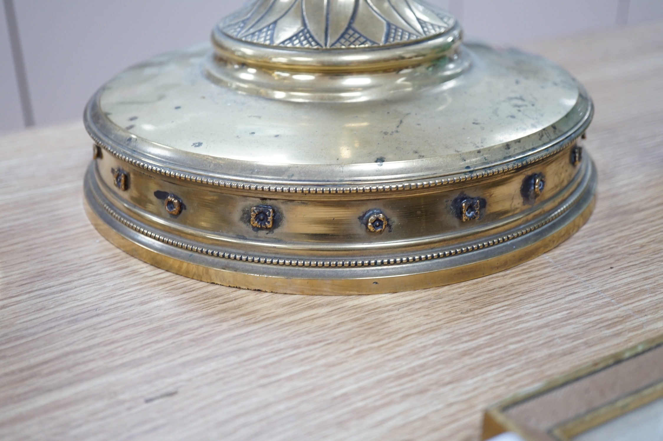 A pair of 19th century tall decorative brass ecclesiastical candlesticks, 90cm high. Condition - fair to good